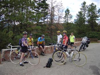 Cyclists at crest of US Hill in New Mexico